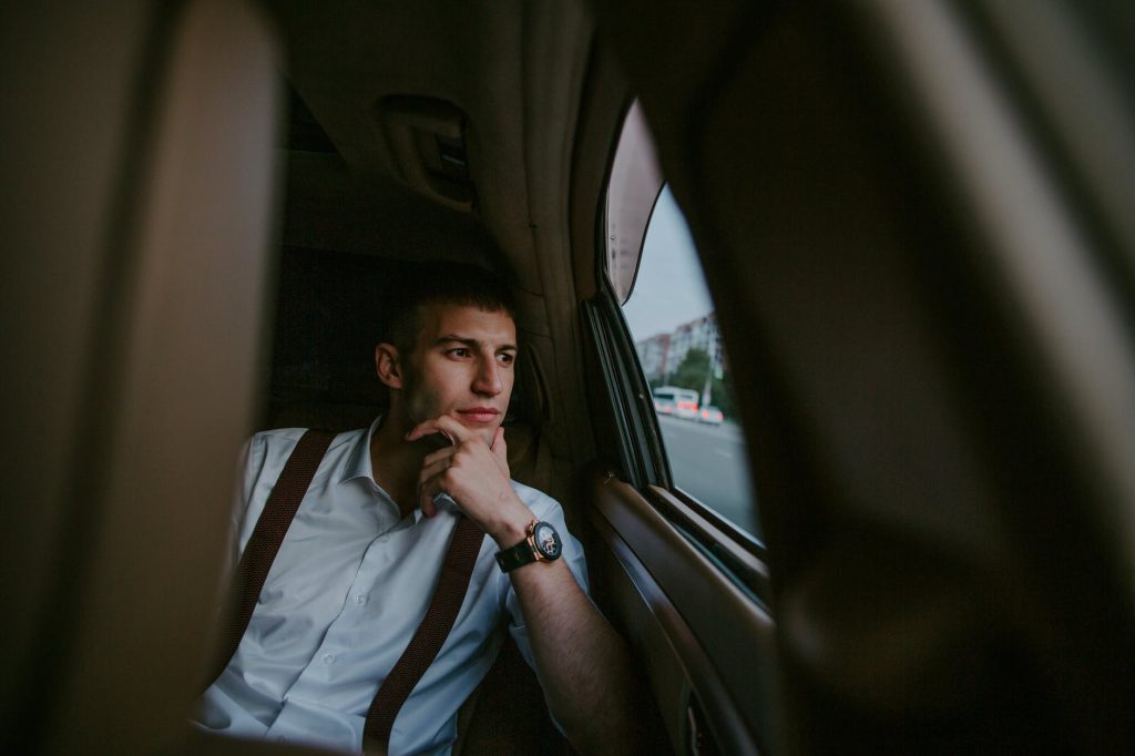 A man contemplating life, staring out of a window